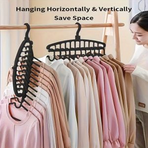 Three Black Plastic Hangers with a Multi-Hook Design - a Space-Saving Wardrobe Organizer for Home And Travel, Durable And Lightweight, Perfect for Tidy Closet Storage And Clothing Hanging